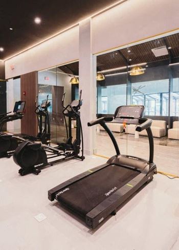 a gym with a lot of equipment in it